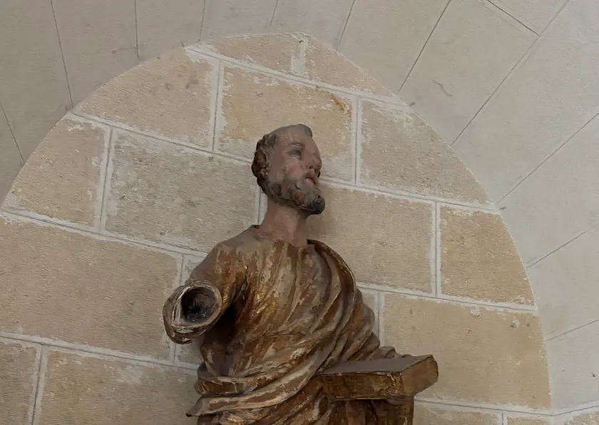 Religious statue in a stone archway niche